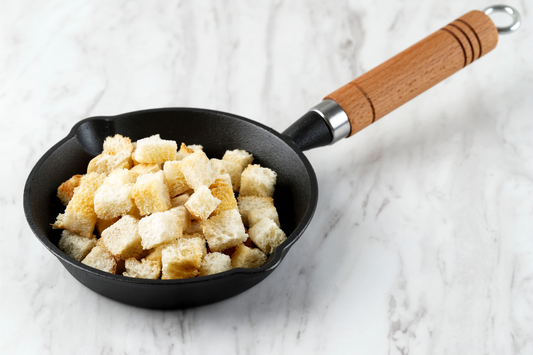 Crispy Homemade Croutons for Soup Side Dish, Served on Cast Iron Pan, Copy Space