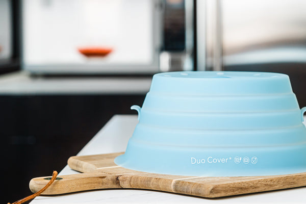 Duo Cover, silicone eco-friendly microwave cover sitting on top of a kitchen counter