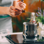 Woman Preparing Homemade Soap with Essential Oil Extracts