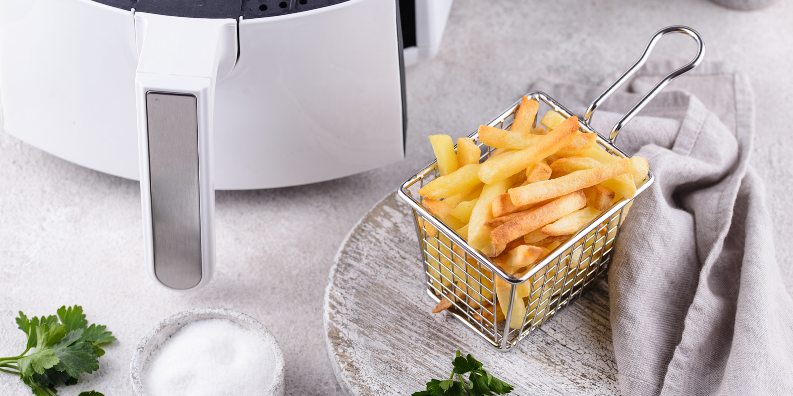 French fries cooked in an air fryer. Healthier food options. Low fat diet.