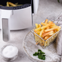 French fries cooked in an air fryer. Healthier food options. Low fat diet.