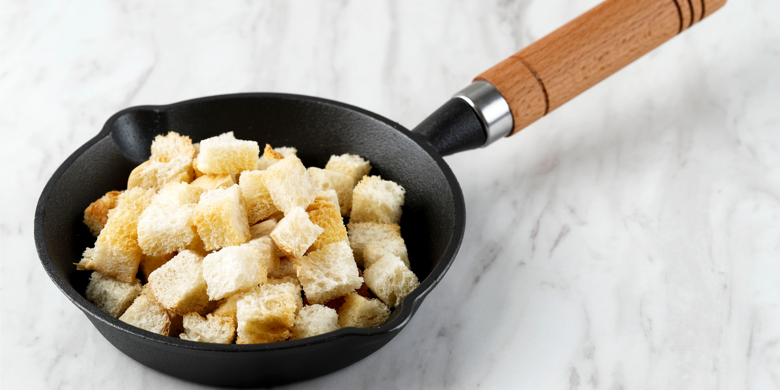  Crispy Homemade Croutons for Soup Side Dish, Served on Cast Iron Pan, Copy Space