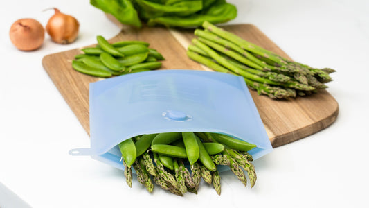 meal prepping food, storing it in silicone reusable bags. sustainable meal-prepping