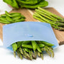 Zipbag sitting on the counter being used to store vegetables. Reusable silicone bag