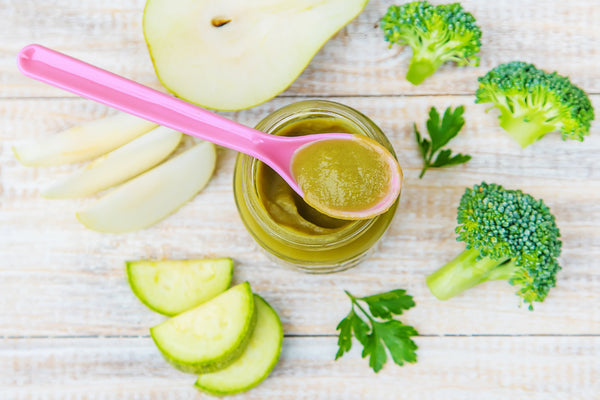 Homemade baby food in small jars. Selective focus