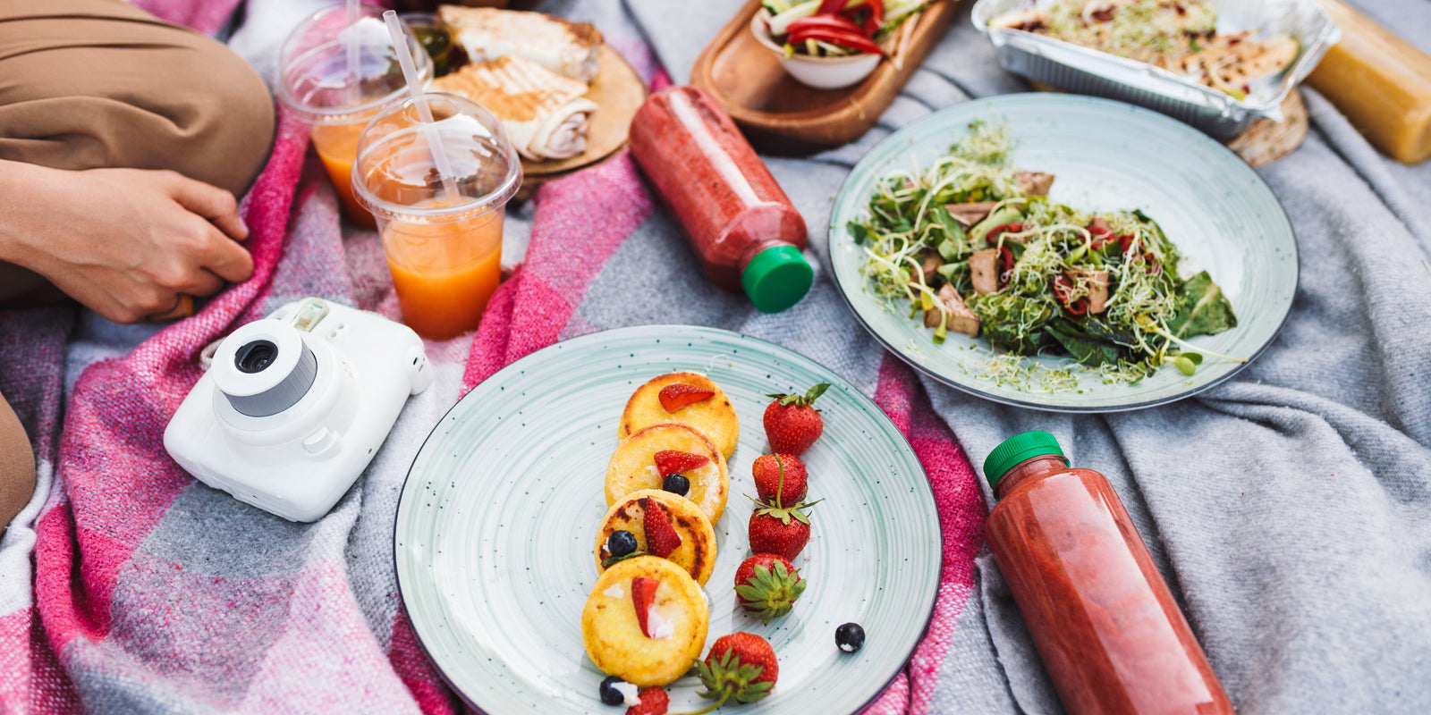 Close-up photo, picnic food and drinks on a blanket in park, meals for picnics.