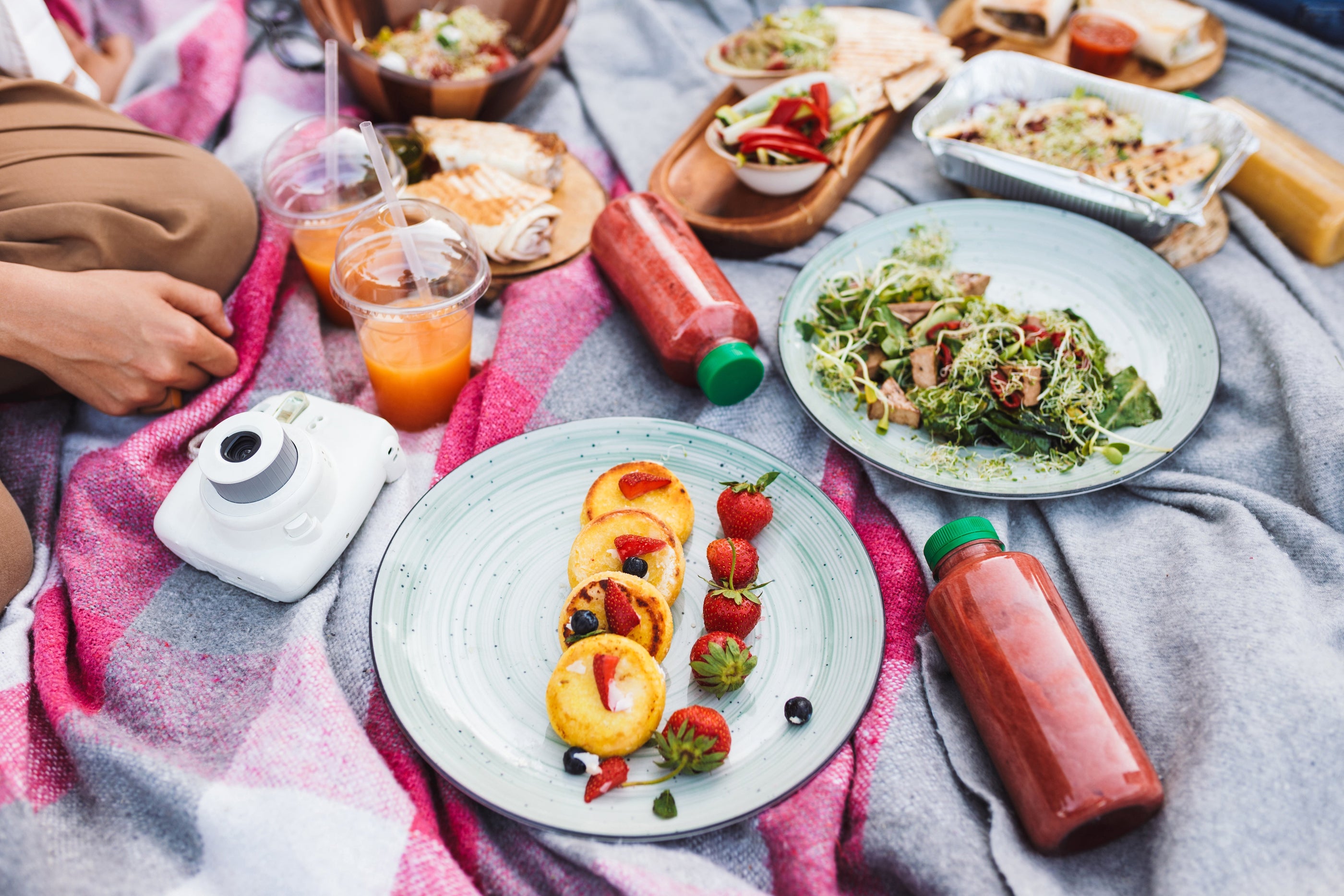 Close-up photo, picnic food and drinks on a blanket in park, meals for picnics.
