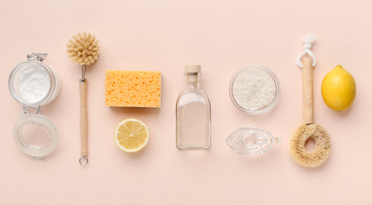 Flat lay composition with eco-friendly natural cleaners. Baking soda, salt, lemon, bamboo brushes on pink background, panorama