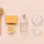 Flat lay composition with eco-friendly natural cleaners. Baking soda, salt, lemon, bamboo brushes on pink background, panorama