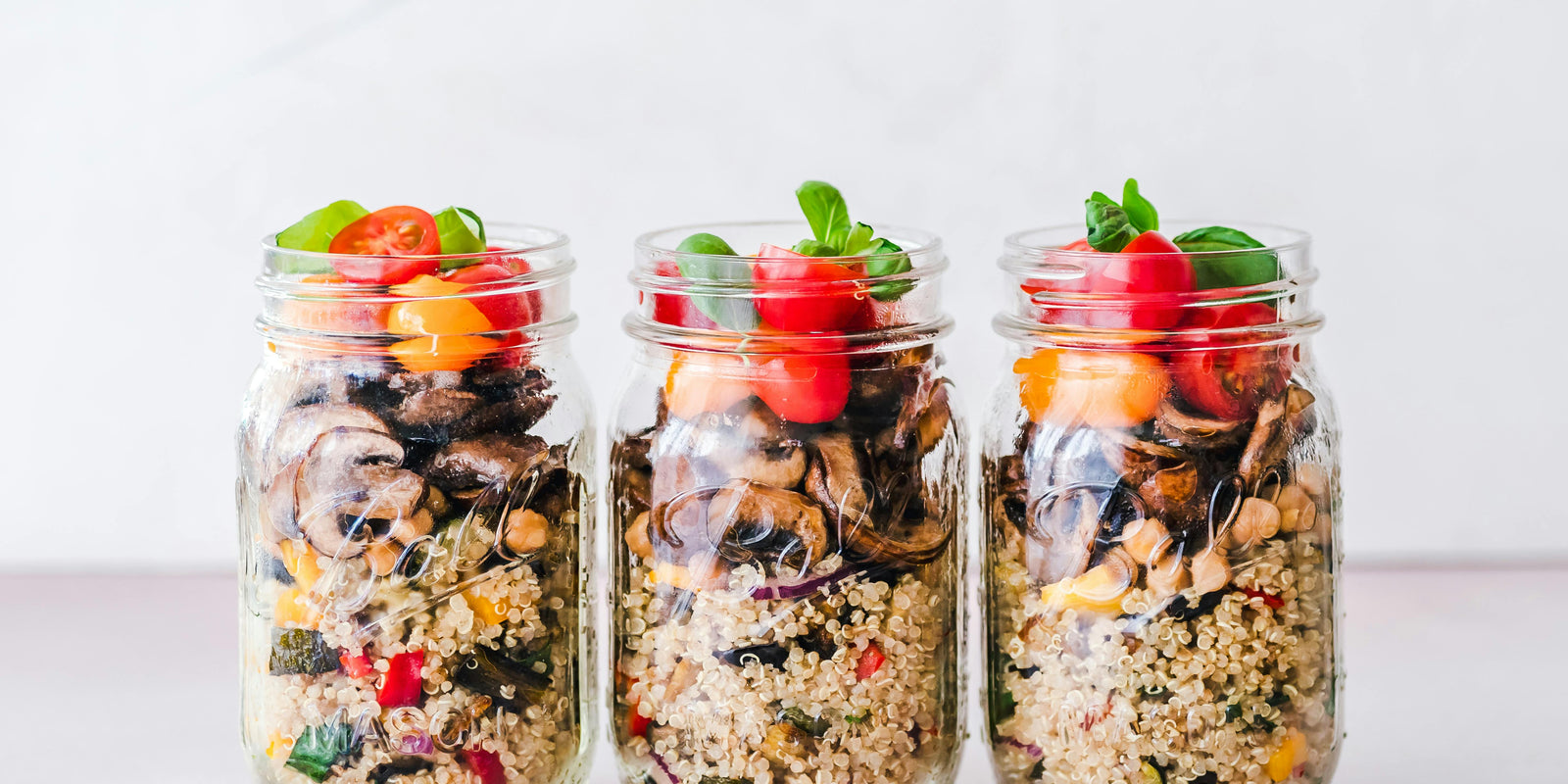 Healthy breakfast meal prep, mason jars with oats and fruits