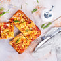 pizza with chicken and tomatoes. Square shape pizza on a clear plate. White background.