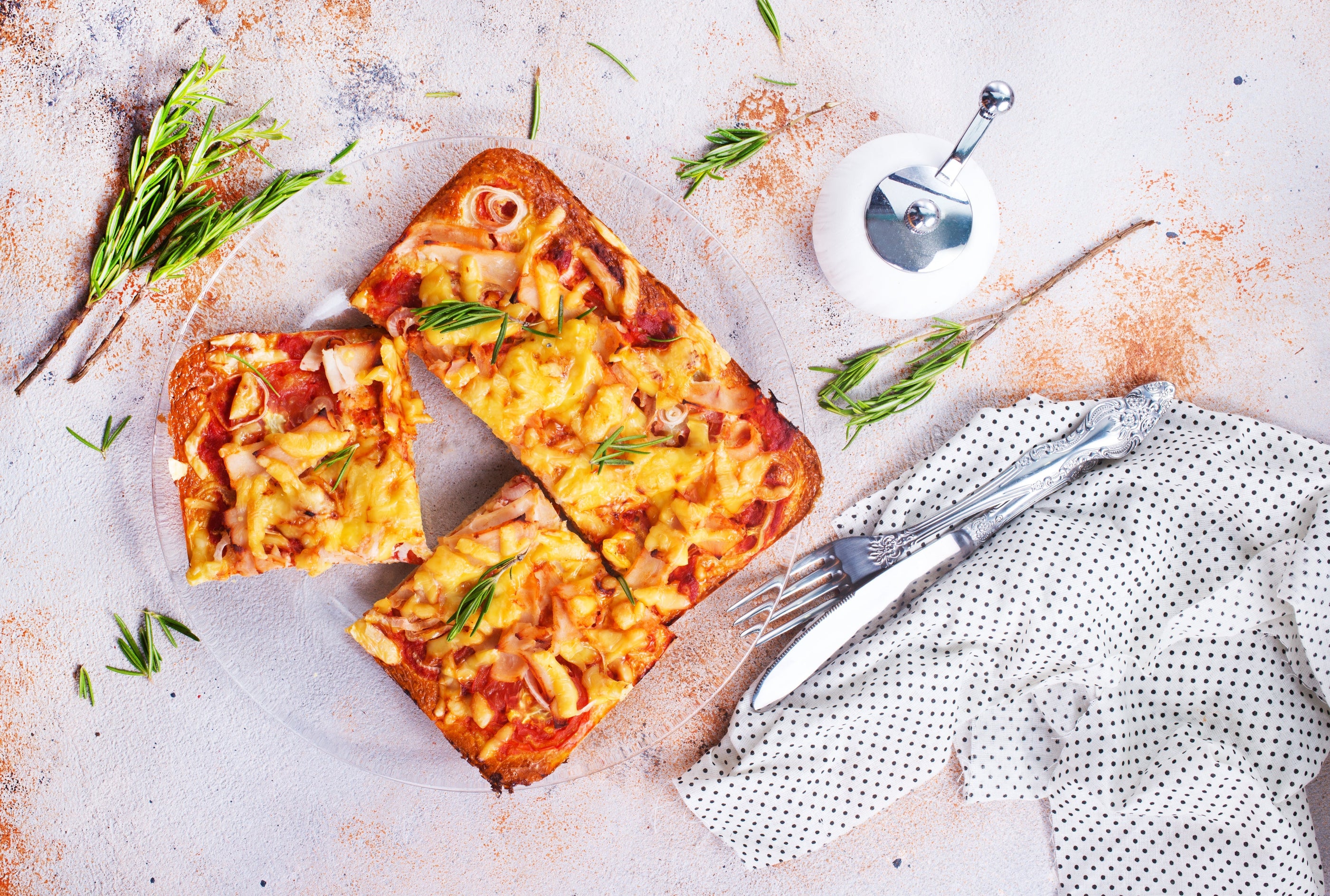 pizza with chicken and tomatoes. Square shape pizza on a clear plate. White background.